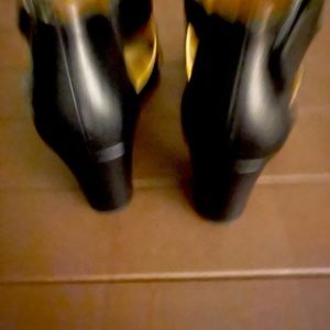 Size 5 1/2 black opened toe thick heel worn once.